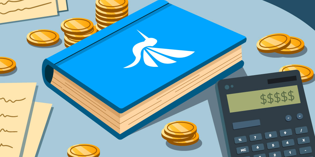 A table covered by a blue book, a calculator and several coins
